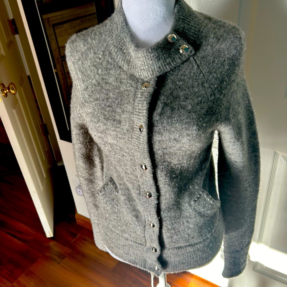 Beautiful gray sweater jacket . Stud buttons 
can be worn alone or as a jacket
